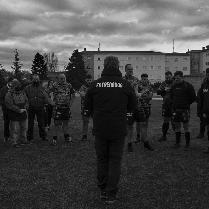  Coach Motivates Rugby Team During Outdoor Training Session in Overcast Weather. 