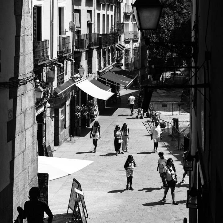  Summer street scene at Puerta de Cuchilleros steps leading to Plaza Mayor in Madrid, Spain. 