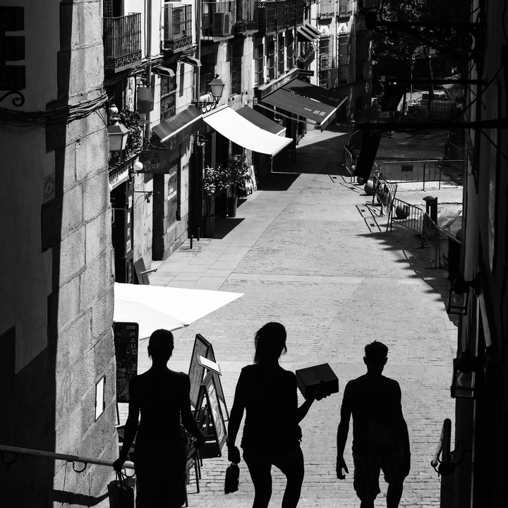  Summer street scene at Puerta de Cuchilleros steps leading to Plaza Mayor in Madrid, Spain. 