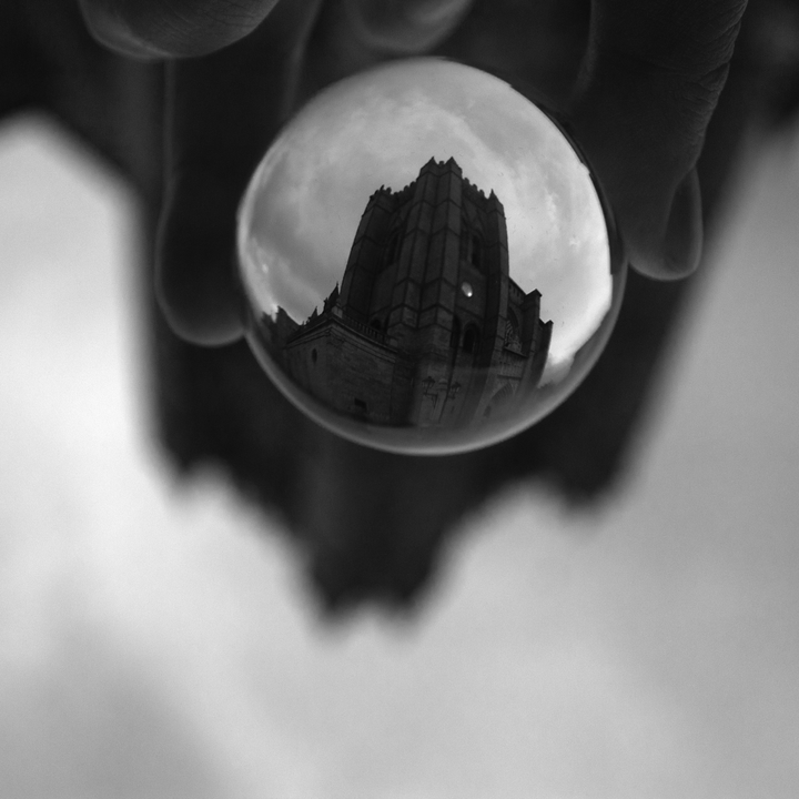 Tower of the Cathedral of Avila through a glass ball 