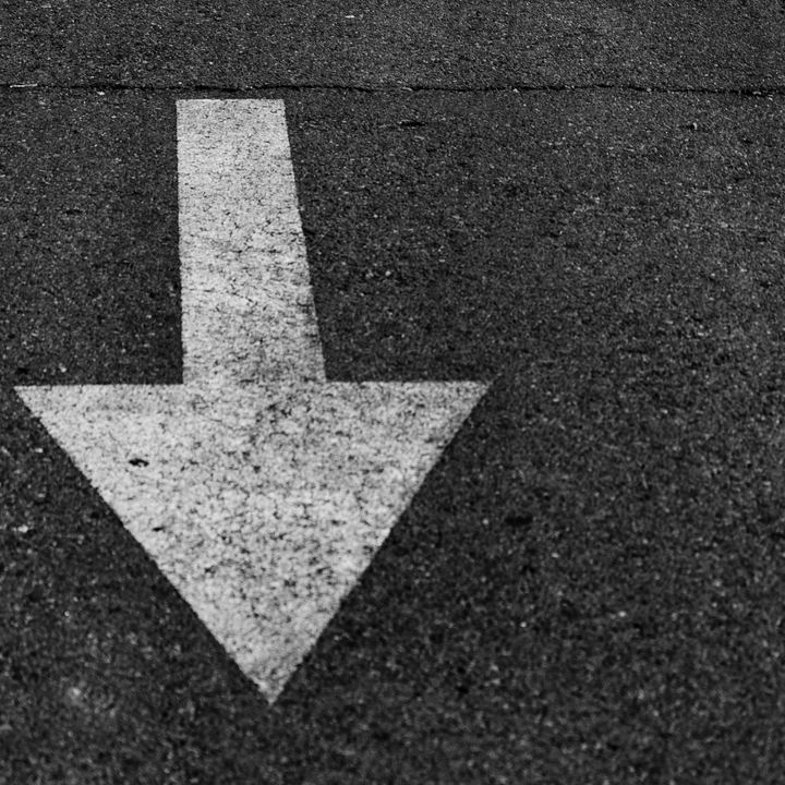 Arrow mark on asphalt 