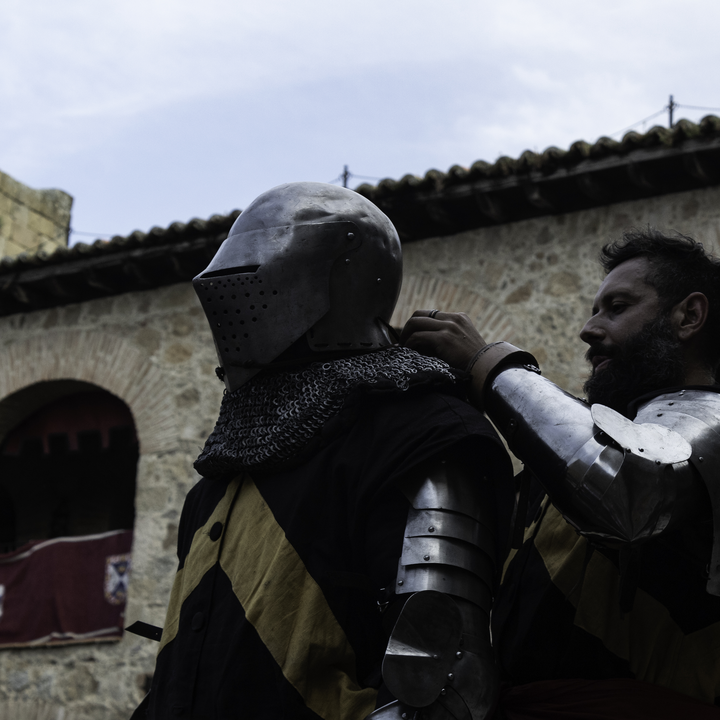 Warrior getting ready fo a sword and shield duel tournament at Medieval Fair, Oropesa, Toledo, Spain ( IG/@indomitus.medievalcombatclub)