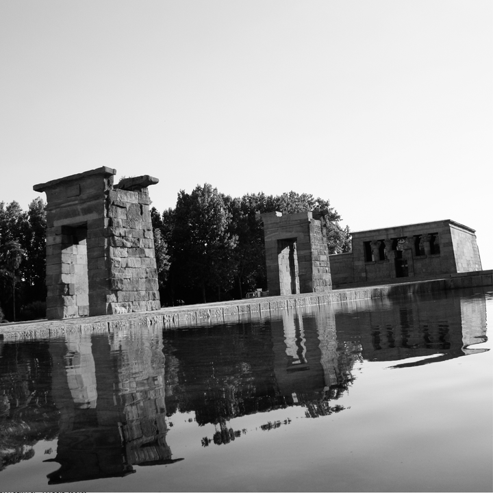  Reflections of Time: Debod Temple Silhouetted in Serene Monochrome Stillness. 