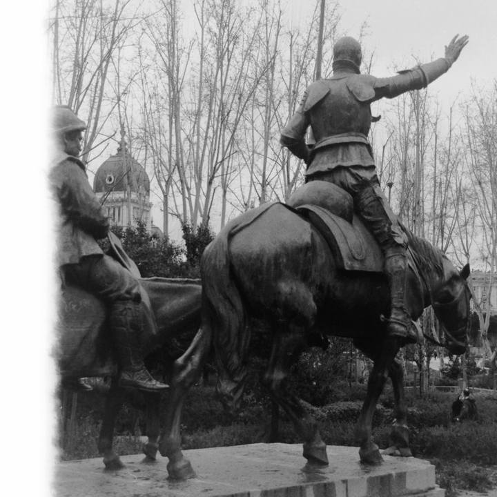 Monumental Don Quixote and Sancho Panza Statue at Plaza de España in Madrid Captured in Black and White