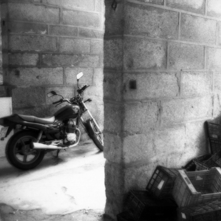 Motorbike parked near the column 
